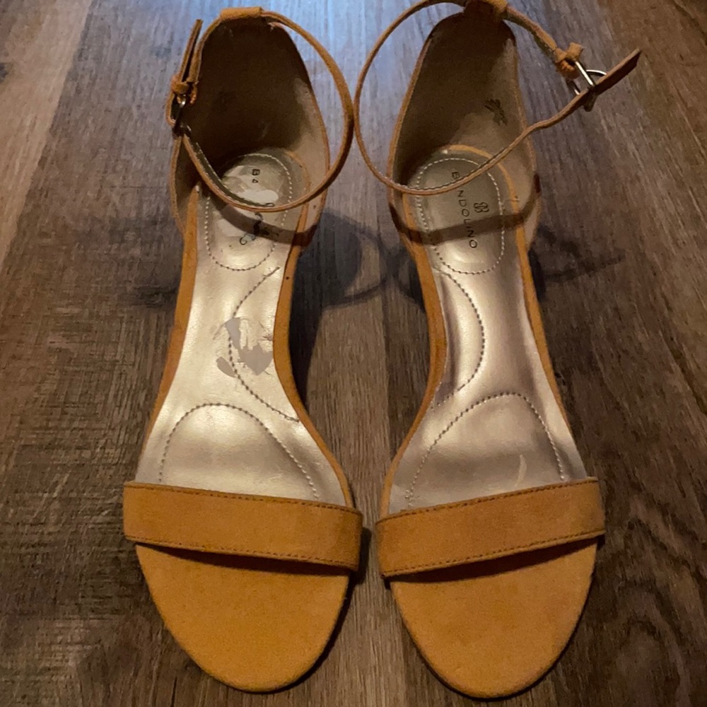 Never worn (sticker residue on right foot)